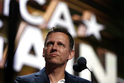 Billionaire tech investor Peter Thiel looks over the podium before the start of the second day session of the Republican National Convention in Cleveland, Tuesday, July 19, 2016. Thiel, a Silicon Valley billionaire and advisor to former President Donald Trump, is leaving the board of directors of Facebook parent company Meta, the company announced Monday, Feb. 7, 2022. (AP Photo/Carolyn Kaster, File)