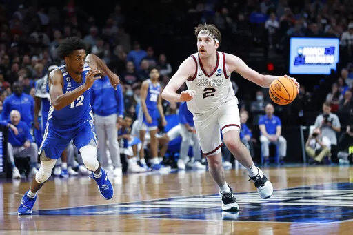 Gonzaga forward Drew Timme (2) drives past Memphis forward DeAndre Williams (12) during the second half of a second-round NCAA college basketball tournament game, Saturday, March 19, 2022, in Portland, Ore. (AP Photo/Craig Mitchelldyer)