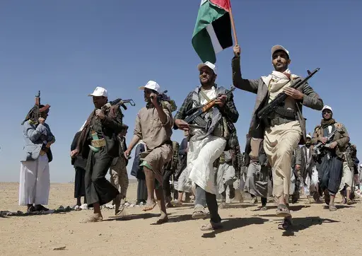 Houthi rebel fighters march during a rally of support for the Palestinians in the Gaza Strip and against the U.S. strikes on Yemen outside Sanaa on Jan. 22, 2024. (AP Photo, File)