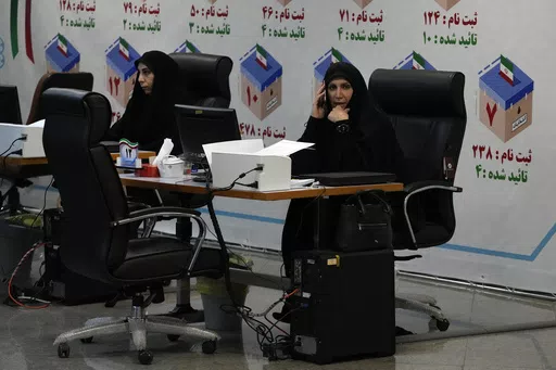 Iranian elections headquarters staff work to register candidates for the June 28 presidential elections at the Interior Ministry in Tehran, Iran, Thursday, May 30, 2024. Iran opened a five-day registration period Thursday for hopefuls wanting to run in the presidential election to replace the late Ebrahim Raisi, who was killed in a helicopter crash earlier this month with seven others. (AP Photo/Vahid Salemi)