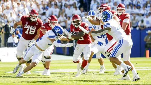 Arkansas running back Raheim Sanders (5) runs the ball during an NCAA college football game against BYU, Saturday, Oct. 15, 2022 in Provo, Utah. (Ben B. Braun/The Deseret News via AP)