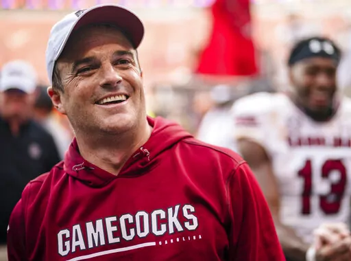 South Carolina head coach Shane Beamer smiles after defeating Clemson 31-30 in an NCAA college football game on Saturday, Nov. 26, 2022, in Clemson, S.C. (AP Photo/Jacob Kupferman)