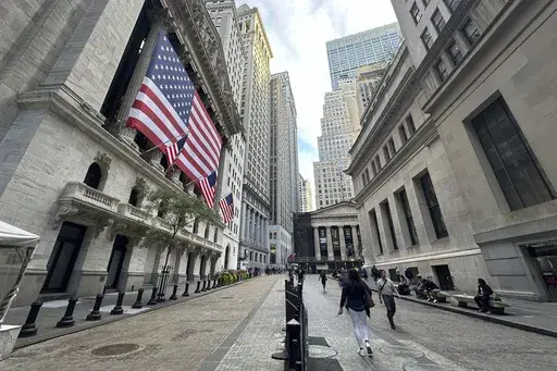 American flags hang from the front of the New York Stock Exchange on Sept. 11, 2024, in New York. (AP Photo/Peter Morgan, File)