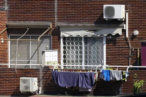 Air conditioning external units are seen on the facade of a building in Rome, Tuesday, July 25, 2023. Rising global temperatures are elevating air conditioning from a luxury to a necessity in many parts of Europe, which long has had a conflictual relationship with energy-sucking cooling systems deemed by many a U.S. indulgence. (AP Photo/Andrew Medichini)