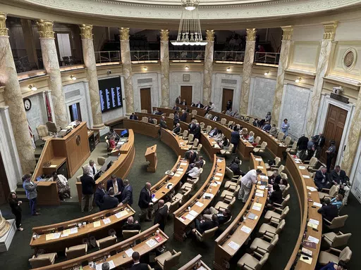 Representatives gather in the Arkansas House chamber at the state Capitol in Little Rock, Ark., on Thursday, May 9, 2024, for the final day of the legislative session. The Legislature adjourned with the House not giving final approval to the budget for the state Game and Fish Commission. (AP Photo/Andrew DeMillo)