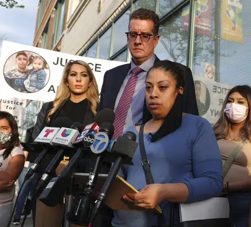 Veronica Alvarez, foreground, the mother of 22-year-old Anthony Alvarez, reads a statement to the media on Tuesday, April 27, 2021, after watching video of her son's fatal shooting. Her attorney Todd Pugh stands behind her. No charges will be filed against the Chicago police officers who fatally shot 13-year-old Adam Toledo and 22-year-old Anthony Alvarez during foot pursuits within days of each other last year, a prosecutor announced Tuesday, March 15, 2022. (Terrence Antonio James/Chicago Trib