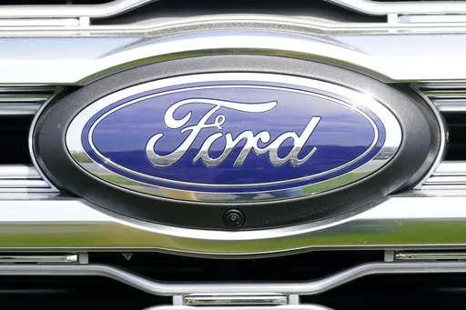A logo on a vehicle at a Ford dealership in Springfield, Pa., Tuesday, April 26, 2022. Ford is recalling more than 1.5 million vehicles in the U.S. in two actions to fix leaky brake hoses and windshield wiper arms that can break. The company says in documents posted Friday, March 17, 2023 by safety regulators that the front brake hoses can rupture and leak brake fluid. (AP Photo/Matt Rourke, File)