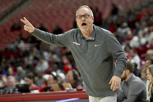Arkansas coach Mike Neighbors directs his team during the first half of an NCAA college basketball game against South Carolina, Thursday, Feb. 29, 2024, in Fayetteville, Ark. (AP Photo/Michael Woods, File)