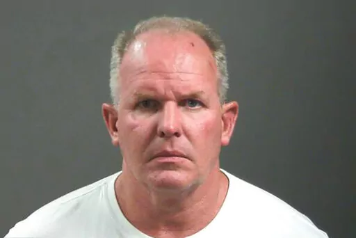 This photo provided by Washington County, Arkansas shows Douglas Ramsey.  Officials say Ramsey, a vegan food products company executive has been charged with felony battery and making a terroristic after a fracas outside a football game in which he's accused of biting a man's nose.  Ramsey, Beyond Meat Chief Operations Officer,  is accused in the road rage attack outside Saturday, Sept. 17, 2022, game in Fayetteville between the Arkansas Razorbacks and Missouri State Bears.   (Washington County,