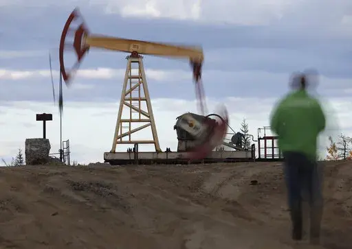 Sept. 10, 2011 file photo photo showing an oil rig near the town of Usinsk, 1500 kilometers (930 miles) northeast of Moscow. The European Union's executive commission has proposed phasing out imports of Russian oil within six months. It is part of Europe's struggle to stop paying Russia $850 million a day for energy and hit the Kremlin's finances over its invasion of Ukraine.  (AP Photo/Dmitry Lovetsky)
