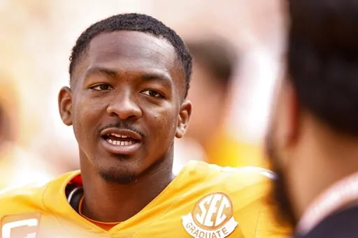 Tennessee quarterback Hendon Hooker (5) takes a break on the sideline during the second half of an NCAA college football game against Tennessee Martin, Saturday, Oct. 22, 2022, in Knoxville, Tenn. Tennessee won 65-24. Hooker was named the Offensive player of the year on the All-SEC team announced Monday, Dec. 5, 2022. (AP Photo/Wade Payne, File)