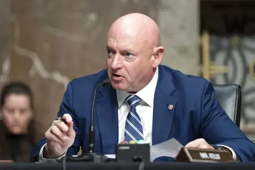 Sen. Mark Kelly, D-Ariz., speaks during a hearing of the Senate Armed Services Committee, on Capitol Hill, in Washington, March 24, 2022.  A year ago, Arizona’s Democratic Secretary of State Katie Hobbs was all over cable news, building a national profile as a defender of democracy and raking in cash for her campaign for governor. Democratic Sen. Mark Kelly, newly elected to finish John McCain’s last term and running for re-election, looked to be among the most vulnerable members of the Sena