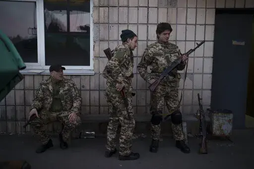 Civilian volunteers attend a training camp of the Ukrainian Territorial Defense Forces in Brovary, northeast of Kyiv, Ukraine, Monday, March 21, 2022. (AP Photo/Felipe Dana)