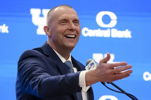FILE -Mark Pope speaks to fans and media after being named Kentucky men's NCAA college basketball head coach in Lexington, Ky., Sunday, April 14, 2024. Mark Pope looks to veterans and being himself as he adapts to coaching Kentucky after John Calipari. (AP Photo/James Crisp, File)