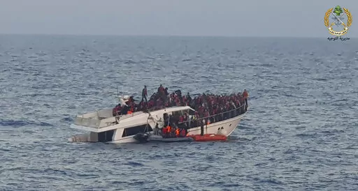 File In this photo released by the Lebanese Army, shows Lebanese army on their dinghy, rescuing migrants from a boat sinking in the Mediterranean Sea, near the shores of Tripoli, north Lebanon, Saturday, Dec. 31, 2022. A short Lebanese army statement said the vessel was carrying people "who were trying to illegally leave Lebanon's territorial waters." It said three Lebanese navy boats and one from the U.N. peacekeeping force in Lebanon, known as UNIFIL, were rescuing the approximately 200 migran