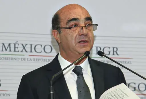 Mexico's Attorney General Jesus Murillo Karam gives a news conference in Mexico City, Dec. 7, 2014. The Mexican Attorney General's Office reported on Friday, Aug. 19, 2022, it has detained Murillo Karam, who was in charge of the investigation into the disappearance of the 43 student teachers that occurred in southern Mexico in 2014. (AP Photo/Marco Ugarte, File)