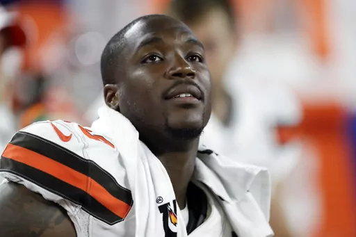 Cleveland Browns defensive end Chris Smith sits on the sideline during the first half of an NFL preseason football game against the Washington Redskins in Cleveland, Aug. 8, 2019. Former NFL defensive end Chris Smith, who was touched by tragedy while he played for the Cleveland Browns, has died. He was 31. Smith's agent, Drew Rosenhaus, and the Browns confirmed his passing Tuesday, April 18, 2023. (AP Photo/Ron Schwane, File)
