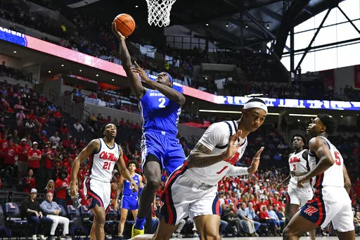 Memphis center Jalen Duren shoots over Mississippi guard Austin Crowley during the first half of an an NCAA college basketball game in Oxford, Miss., Saturday, Dec. 4, 2021. Duren is one of the top big men in the 2022 NBA draft. (AP Photo/Thomas Graning, File)