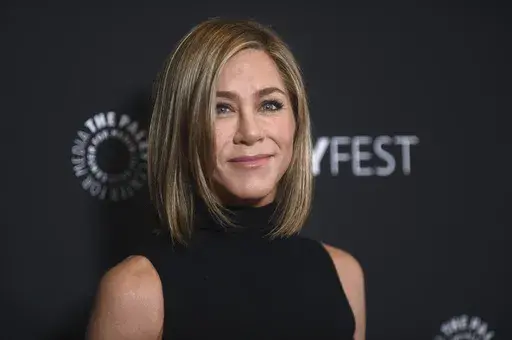 Jennifer Aniston arrives at a screening of "The Morning Show" during PaleyFest, April 12, 2024, at the Dolby Theatre in Los Angeles. Aniston will soon become a children's author. The “Friends” star has a 4-book deal with HarperCollins Publishers and animation studio Invisible Studio for a series of works featuring the animated dog Clydeo, based on the actor's own rescue pet, Clyde. (Photo by Richard Shotwell/Invision/AP, File)