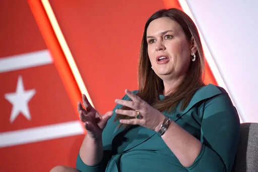 Then-Arkansas Gov.-elect Sarah Huckabee Sanders answers a question while taking part in a panel discussion during a Republican Governors Association conference on Nov. 16, 2022, in Orlando, Fla. Arkansas Gov. Huckabee Sanders is tapping into a debate that's sharply divided Latinos with her decision to ban most state agencies from using the gender neutral term Latinx. Sanders this month signed an order banning the term by agencies. It was one of her first acts as governor. (AP Photo/Phelan M. Ebe