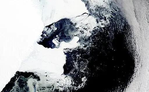 This satellite image provided by NASA, Aqua MODIS 12 on March 2022  shows the main piece of C-37 close to Bowman Island.  Scientists are concerned because an ice shelf the size of New York City collapsed in East Antarctica, an area that had long been thought to be stable. The collapse last week was the first time scientists have ever seen an ice shelf collapse in this cold area of Antarctica. (NASA via AP)