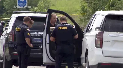 This image from video provided by KATV shows police officers at the scene where Stacy Lee Drake was taken into custody, June 20, 2024, in Morrilton, Ark. (KATV via AP, File)
