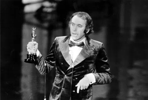 Producer Albert S. Ruddy accepts the Oscar for best picture for "The Godfather" at the 45th Annual Academy Awards ceremony in Los Angeles, Calif., on March 27, 1973. The Canadian-born producer and writer who won Oscars for “The Godfather” and “Million Dollar Baby,” died Saturday, May 25, 2024, at age 94. (AP Photo, File)