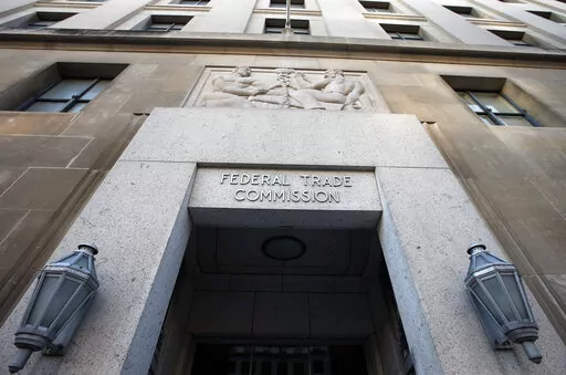This Jan. 28, 2015, file photo shows the Federal Trade Commission building in Washington. Walmart and Kohl's are paying a combined $5.5 million in settlements after the Federal Trade Commission said they falsely marketed dozens of sheets and other home textile products as made of environmentally friendly bamboo, when they were actually rayon. (AP Photo/Alex Brandon, File)