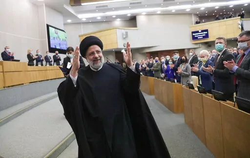 In this handout photo released by The State Duma, The Federal Assembly of The Russian Federation Press Service, Iranian President Ebrahim Raisi gestures after delivering his speech at the State Duma, the Lower House of the Russian Parliament in Moscow, Russia, Jan. 20, 2022. Russia’s war on Ukraine has exposed just how much Iran has tilted toward Moscow in recent years. Among ordinary Iranians, there is a great deal of sympathy for Ukraine. (The State Duma, The Federal Assembly of The Russian 