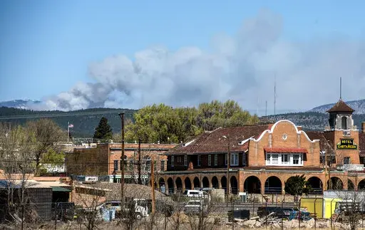 The Calf Fire burns northwest of Las Vegas in San Miguel County Friday, April 22, 2022. Destructive Southwest fires have burned dozens of homes in northern Arizona and put numerous small villages in New Mexico in the path of danger, as wind-fueled flames chewed up wide swaths of tinder dry forest and grassland and towering plumes of smoke filled the sky.(Eddie Moore/Albuquerque Journal)/The Albuquerque Journal via AP)