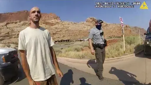 This Aug. 12, 2021, file photo from video provided by the Moab, Utah, Police Department shows Brian Laundrie talking to a police officer after police pulled over the van he was traveling in with his girlfriend, Gabrielle "Gabby" Petito, near the entrance to Arches National Park in Utah. Laundrie, the boyfriend of slain cross-country traveler Gabby Petito, took responsibility for killing her in a notebook discovered near his body in a Florida swamp, the FBI announced Friday, Jan. 21, 2022. (The M