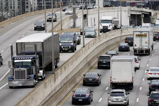 Motor vehicle traffic moves along the Interstate 76 highway in Philadelphia, March 31, 2021. Dozens of Republican attorneys general on Monday, May 13, 2024, took legal action against the Biden Administration and California over new emissions limits for trucks. (AP Photo/Matt Rourke, File)