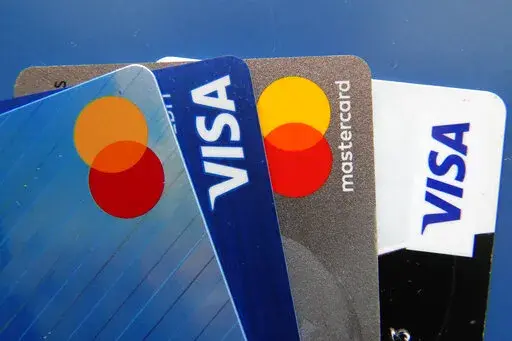 Credit cards as seen Thursday, July 1, 2021, in Orlando, Fla.  When the Federal Reserve announces that it’s raising interest rates, it’s all over the news. And unlike other kinds of loans with fixed rates, credit card interest is variable, meaning rates will go up as a result of the Fed’s decision. If you have credit card debt, should you be worried? Not any more than usual.  (AP Photo/John Raoux, File)
