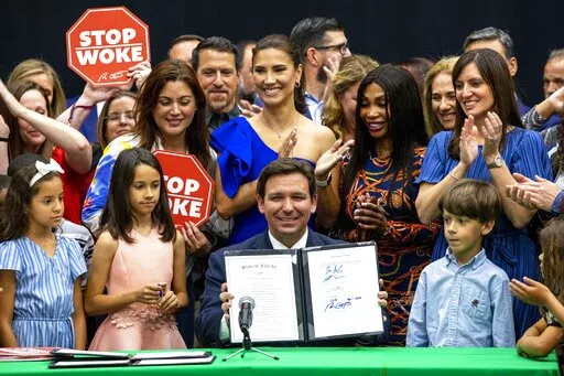 Florida Gov. Ron DeSantis reacts after publicly signing HB7, "individual freedom," also dubbed the "stop woke" bill during a news conference at Mater Academy Charter Middle/High School in Hialeah Gardens, Fla., on Friday, April 22, 2022. DeSantis also signed two other bills into laws including one regarding the "big tech" bill signed last year but set aside due to a court ruling, and the special districts bill, which relates to the Reedy Creek Improvement District. (Daniel A. Varela/Miami Herald