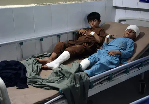 Injured victims of a rain storm are treated at a hospital, in the city of Jalalabad, Nangarhar province east of Kabul, Afghanistan, Monday, July 15, 2024. (AP Photo/Shafiullah Kakar)