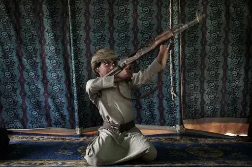 Kahlan, a 12-year-old former child soldier, demonstrates how to use a weapon, at a camp for displaced persons where he took shelter with his family, in Marib, Yemen, July 27, 2018. emen’s Houthi rebels continue to recruit children into their military ranks to fight in the country’s civil war, despite an agreement with the U.N. in April 2022, to halt the practice. Two Houthi officials acknowledged to the Associated Press that the rebels have recruited several hundred children, some as young a