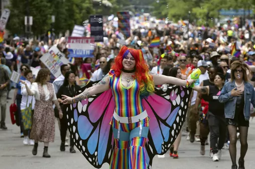 People march in the Pride parade, Saturday, June 10, 2023, in Boston. The biggest Pride parade in New England returned on Saturday after a three-year hiatus, with a fresh focus on social justice and inclusion rather than corporate backing. (AP Photo/Michael Dwyer)