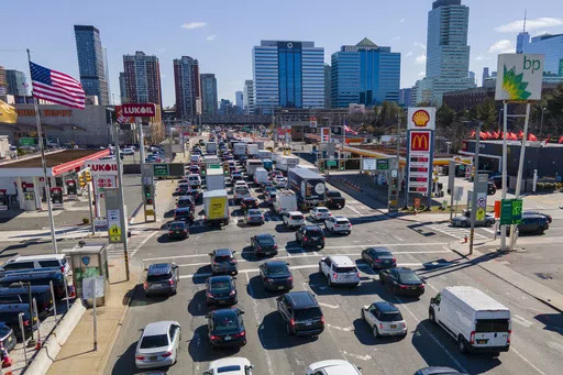 Commuters wait to drive through the Holland Tunnel into New York City during morning rush hour traffic in Jersey City, N.J.,, Wednesday, March 8, 2023. A study published Wednesday, May 22, 2024, says U.S. vehicles hit a record average age of 12.6 years in 2024 as people continue to hang on to their rides largely because new ones cost so much. (AP Photo/Ted Shaffrey, File)