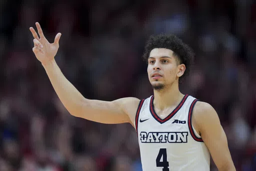 Dayton guard Koby Brea reacts to a 3-point basket during the second half of an NCAA college basketball game against Davidson, Tuesday, Feb. 27, 2024, in Dayton, Ohio. Brea, who led the nation in 3-point shooting last season at Dayton, will play his final season at Kentucky. Brea announced his decision on social media Wednesday, May 1, 2024, and is the fifth player this week and sixth overall to sign with the Wildcats from the transfer portal since new coach Mark Pope was hired April 12. (AP Phot