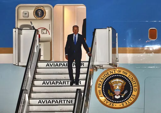 U.S. President Joe Biden steps off Air Force One as he arrives at Melsbroek military airport in Brussels, Wednesday, March 23, 2022. Western leaders are arriving in Brussels for Thursday's summits taking place at NATO and EU headquarters where they will seek to highlight their sense of unity in the face of the Russian invasion in Ukraine. (AP Photo/Olivier Matthys)