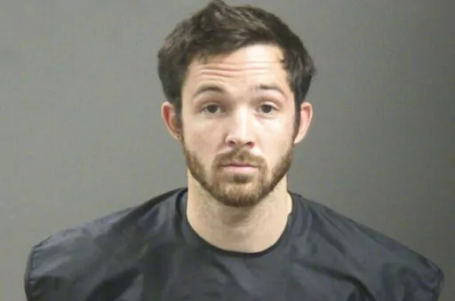 This booking photo provided by the Washington County, Ark., Sheriff's Office shows John Tyson, Tyson Foods chief financial officer. The grandson of the company’s founder has settled public intoxication and criminal trespassing charges filed against him after he broke into a stranger’s home and fell asleep on her bed, pleading guilty to both misdemeanors in a district court in Fayetteville, Ark., on Tuesday, Jan. 24, 2023, according to the Fayetteville city prosecutor's office. (Washington Co