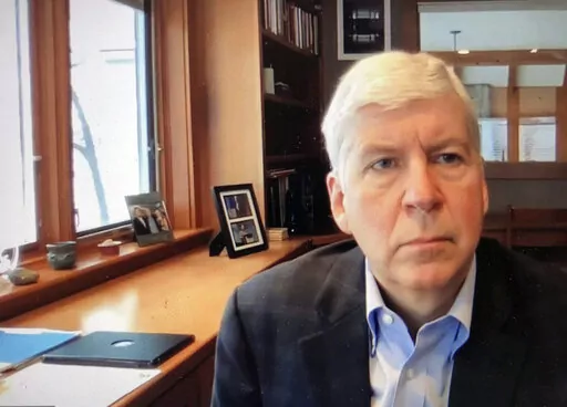 This screen shot from video, shows former Michigan Gov. Rick Snyder, during his Zoom hearing in the 67th District Court in Flint, Mich., on Jan. 18, 2020. A judge had no authority to issue indictments in the Flint water scandal, the Michigan Supreme Court said Tuesday, June 28, 2022 in an extraordinary decision that wipes out charges against former Gov. Snyder, his health director and seven other people (67th District Court in Flint via AP, file)