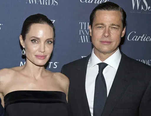 Angelina Jolie Pitt and Brad Pitt pose for a photo at the WSJ Magazine Innovator Awards 2015 at The Museum of Modern Art in New York, on Nov. 4, 2015. (Photo by Charles Sykes/Invision/AP, File)