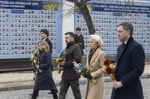 In this photo provided by the Ukrainian Presidential Press Office, Belgian Prime Minister Alexander De Croo, EU Commission President Ursula von der Leyen, Ukrainian President Volodymyr Zelenskyy, Italy's Premier Giorgia Meloni, Canadian Prime Minister Justin Trudeau, from right to left, attend laying flowers ceremony at the Wall of Remembrance to pay tribute to killed Ukrainian soldiers, in Kyiv, Ukraine, Saturday, Feb. 24, 2024. President Volodymyr Zelenskyy has welcomed Western leaders to Kyiv