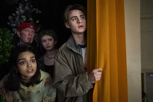 This image released by A24 shows Rachel Zegler, from left, Fred Durst, Lachlan Watson and Jaeden Martell in a scene from "Y2K." (A24 via AP)