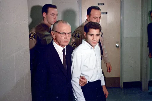This June 1968 photo shows Sirhan Sirhan, right, accused assassin of Sen. Robert F. Kennedy, with his attorney Russell E. Parsons in Los Angeles. In 2021, a California parole board voted to free Robert F. Kennedy's assassin but the decision was overturned by the governor. Sirhan Sirhan will once again appear before the board Wednesday, March 1, 2023, at a hearing at a federal prison in San Diego County to again seek their approval for his release. (AP Photo/File)