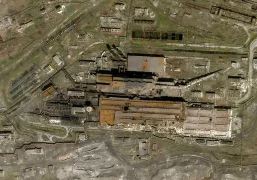 This satellite photo released by Planet Labs and taken on April 20, 2022 shows the Azovstal Steel Plant in Mariupol, Ukraine, with some large holes blasted in the roof. (Planet Labs via AP)
