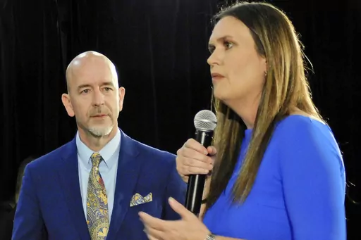 Arkansas Gov. Sarah Huckabee Sanders, right, and Arkansas Secretary of Education Jacob Oliva discuss several aspects of the LEARNS Act on Monday evening, April 24,2023, in the Simpson Theatre at Arkansas State University's Fowler Center in Jonesboro, Ark. An Arkansas judge ruled Friday, June 30, 2023, that a recently passed education law cannot take effect until Aug. 1, putting in doubt state education officials' vote to let a charter school organization take over a small school district. (Nena 