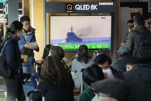 A TV screen shows a file image of a South Korean navy vessel during a news program at the Seoul Railway Station in Seoul, South Korea, Monday, Oct. 24, 2022. The rival Koreas exchanged warning shots along their disputed western sea boundary on Monday, their militaries said, amid heightened animosities over North Korea's recent barrage of weapons tests. (AP Photo/Ahn Young-joon)
