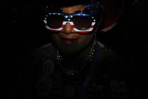 North Carolina delegate Gloria Goodwin wears sunglasses during the Democratic National Convention Wednesday, Aug. 21, 2024, in Chicago. (AP Photo/Brynn Anderson)